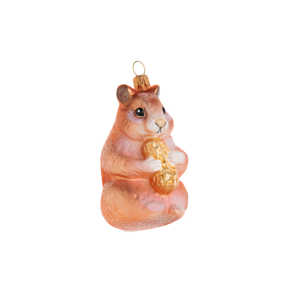 Do you love this rambunctious rodent? The Darling Hamster ornament is an adorable addition to your home and holiday decor. Decorated and coated in glitter for extra fabulousity, the Darling Hamster ornament is clutching onto a little peanut for extra cuteness. Hand crafted glass ornament Dimensions: 3.5" x 2.5"