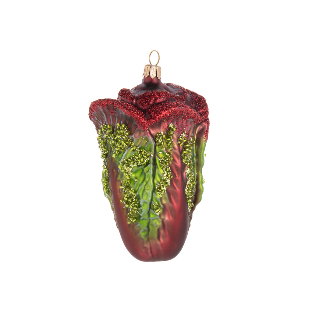 Never has cabbage been so festive! This vivacious vegetable glass ornament is hand finished and glittered to add maximum fun and sparkle to your holiday decor. Hand finished glass ornament. Dimensions: 5" x 2.5".