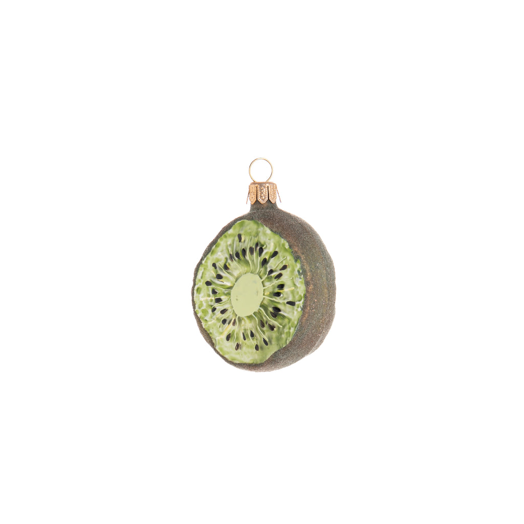 Partake in some sweetness and add it to your holiday decor with this sliced kiwi ornament. Hand crafted and painted, this Enchanted Kiwi Slice ornament is even textured along the edges to be reminiscent of the furry outside of a real kiwi. Hand painted glass ornament Dimensions: 3" x 2.25"