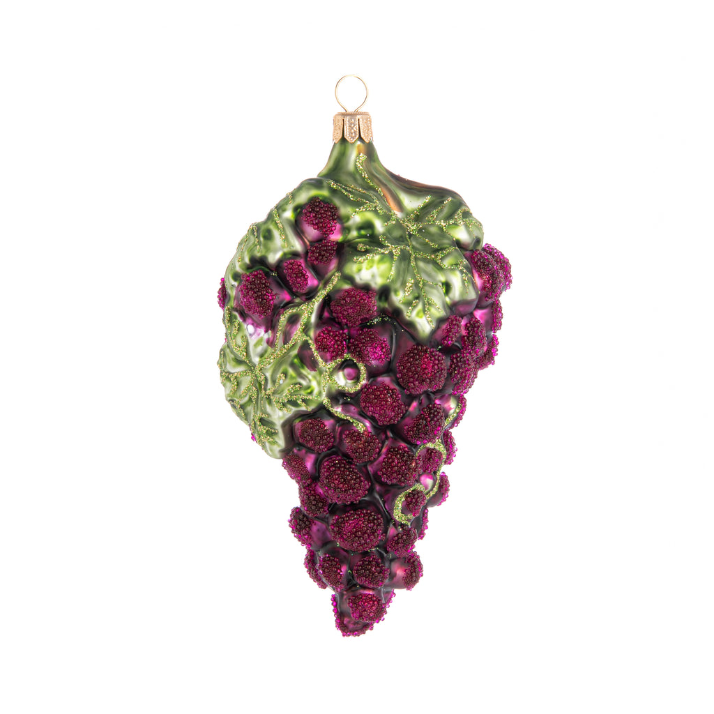 You'll find no reason to 'wine' about your holiday decor with this delightful, bunch of grapes glass ornament. It features 'enchanted' frosting on the grapes, and hand glittered accents on the leaves. Hand finished, glass ornament Dimensions: 6" x 3.5"