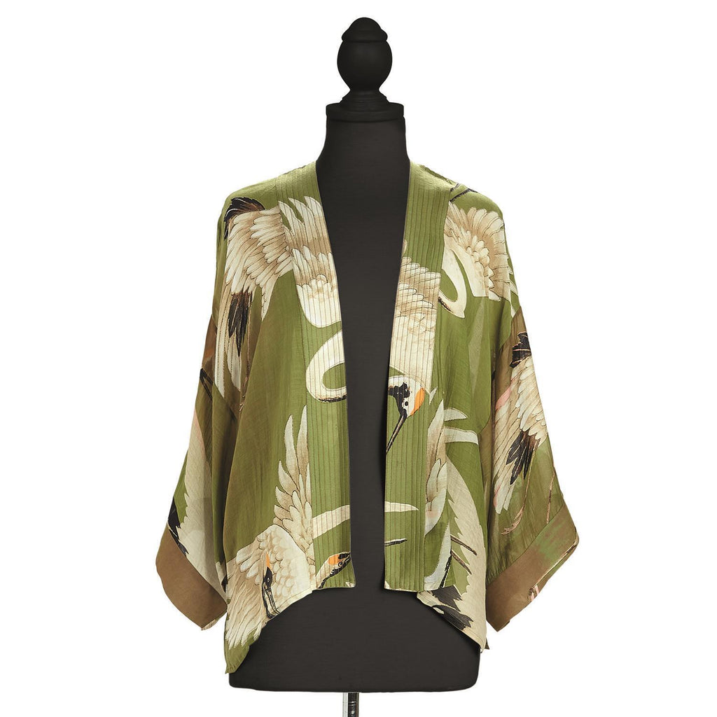 This stylish short kimono features an elegant, vintage-style heron print on a warm olive-green background. This loose-fitting kimono-style jacket has 3/4-length sleeves, an open front, and a lightly embroidered lapel. You can wear this kimono over a dress or camisole, or pair it with jeans. One size fits most.