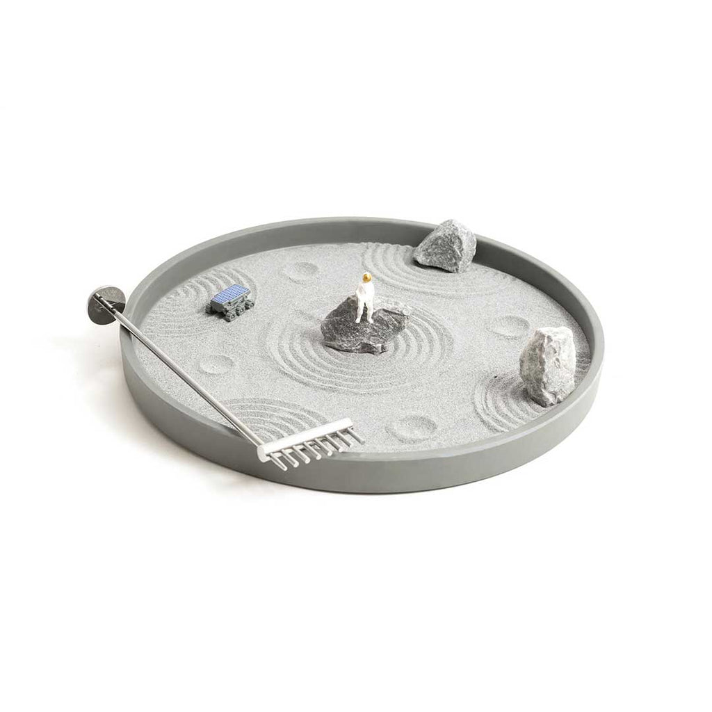 We comb in peace! This Moon Zen Garden comes with moon rocks, gray lunar sand, a chrome rake, a lunar rover, and your very own relax-tronaut. Turn the rake upside down to make a crater-battered lunar surface, or flip it over to create alien symbols in the sand.  Dimensions: 10" diameter x 2" tall.