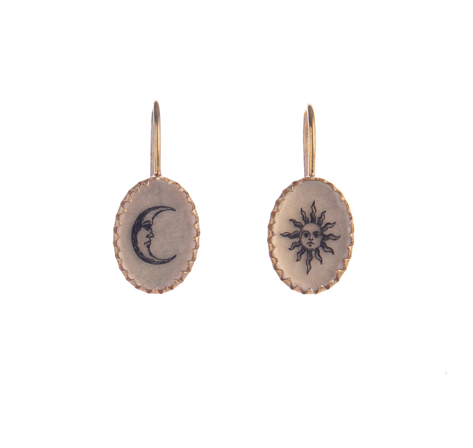 These delicate earrings have a vintage feel and feature hand drawn, Victorian inspired sun and moon artwork set in a scalloped gold vermeil frame. Each pair is individually crafted by hand. Materials: Gold vermeil, resin Handmade with hand-drawn artwork Hook fastening Dimensions: 0.75" x 0.4".