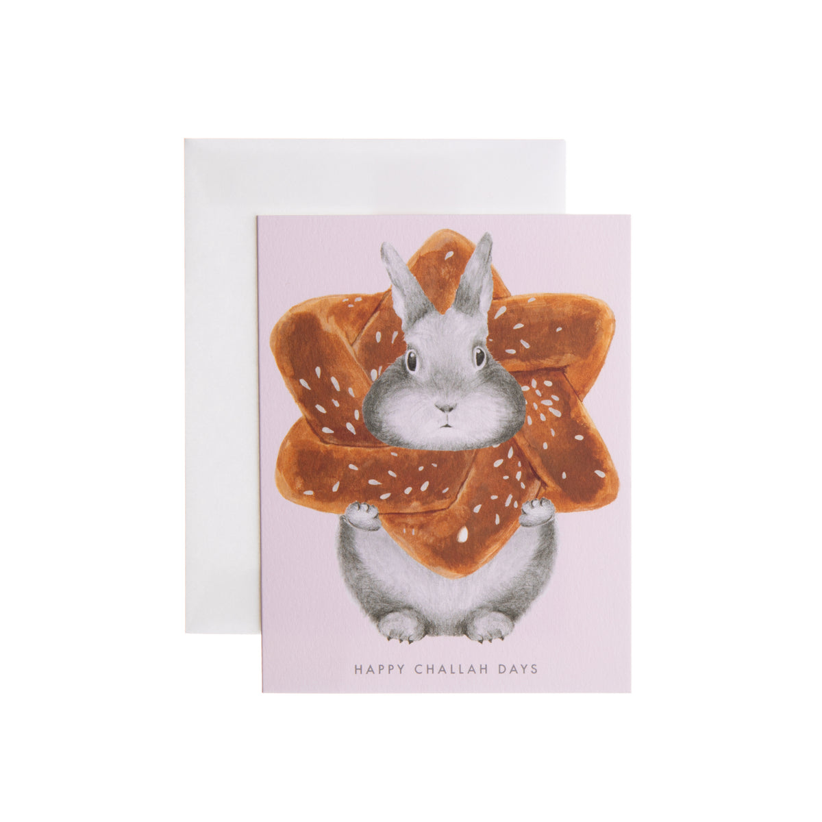 Have a little fun for the holiday with this clever note card that’s designed to delight! Featuring an adorable bunny and delicious challah bread, this note card is sure to bring a smile to anyone who receives it. Printed on soft white paper and paired with a matching envelope Blank interior for personal message Dimensions: 4.25" x 5.5" Made in the USA