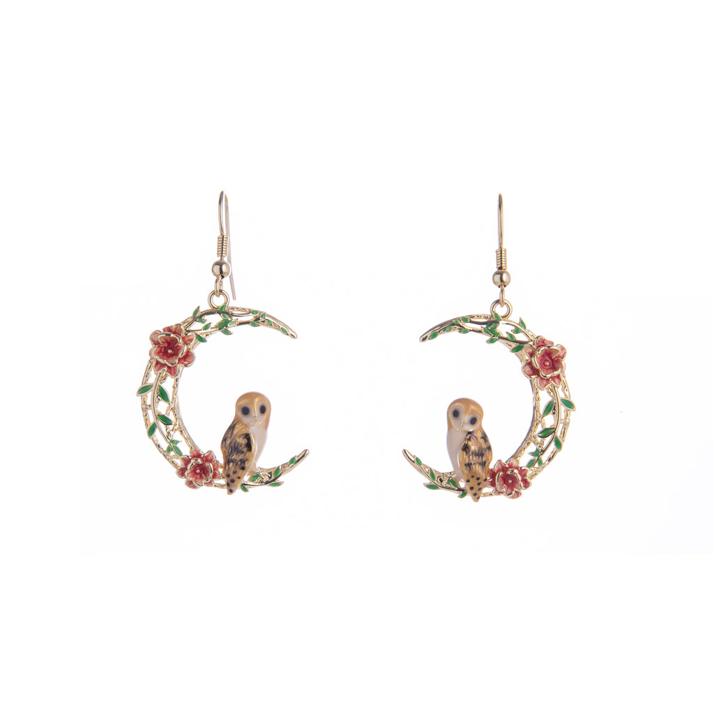 This adorable barn owl perches on a 18ct gold-plated crescent moon adorned with enamel flowers. Even though this owl enjoys its nocturnal activities, these earrings are enchanting enough for day or night. Material: 18ct Gold-plated Brass, Enamel Dimensions: Approx. 1" W x 2" L Fish hook fastening