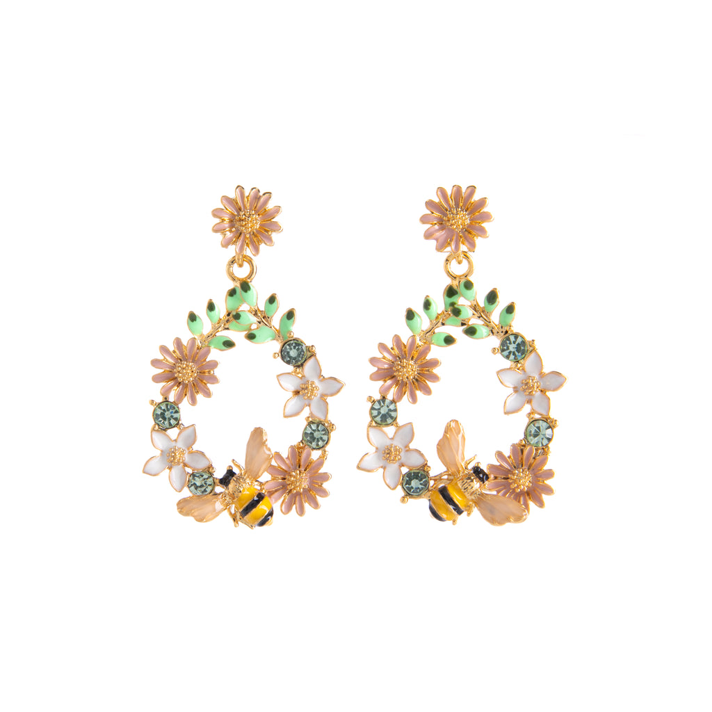The nature-obsessed will adore these floral enamel earrings. Suspended from a pale pink flower, these earrings form a beautiful drop shape consisting of various colored blooms. Pale blue crystals are nestled amongst the flowers alongside a vibrant bee with enamel wings encased in 14ct gold plated brass. 1.5" x 0.75".