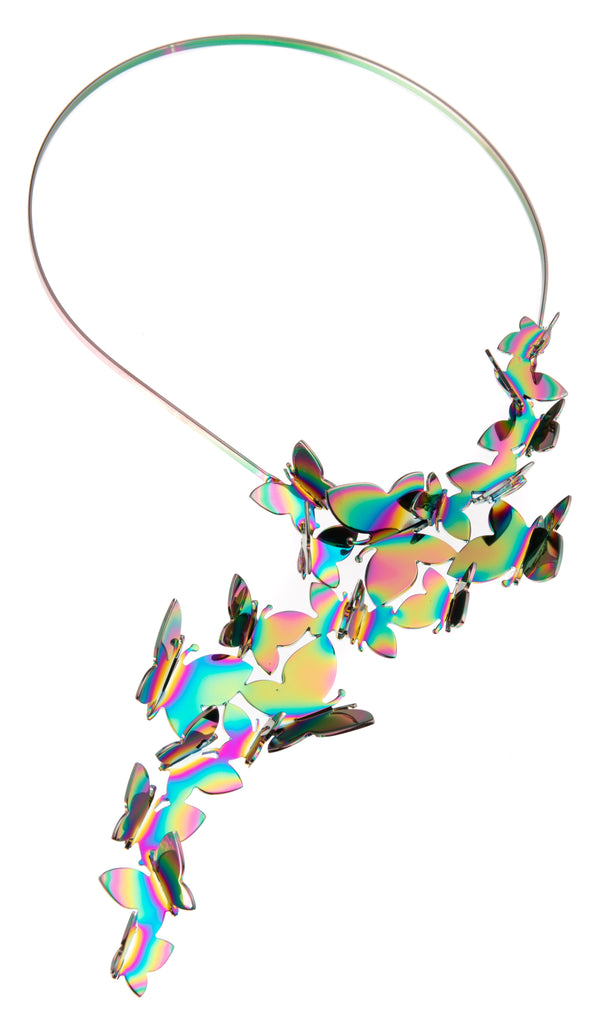 This stunning, statement piece necklace features a cascade of rainbow-colored butterflies. This high-quality, handcrafted necklace drapes around the neck and is lightweight and comfortable to wear. Handcrafted in Italy Materials: Bronze and brass Palladium plated Dimensions: 9.75" long. Neck-cuff diameter: 5".