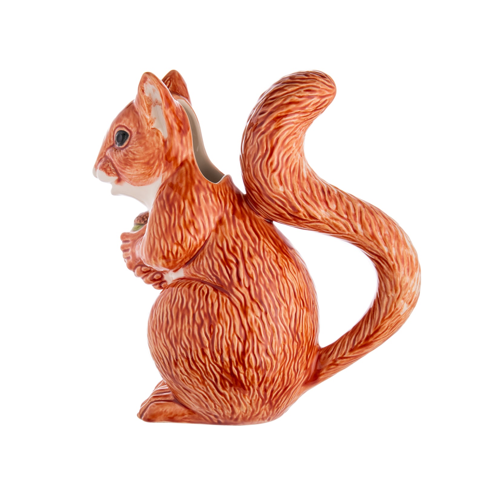 Once you've served drinks from this charming squirrel pitcher, regular pitchers will look downright dull. This cute critter is made by master ceramics atelier Bordallo Pinheiro, which was founded in Caldas da Rainha, Portugal, in 1884. Handmade ceramic pitcher. Dimensions: 9.4" x 5.1" x 10". Capacity: 39 fl oz.