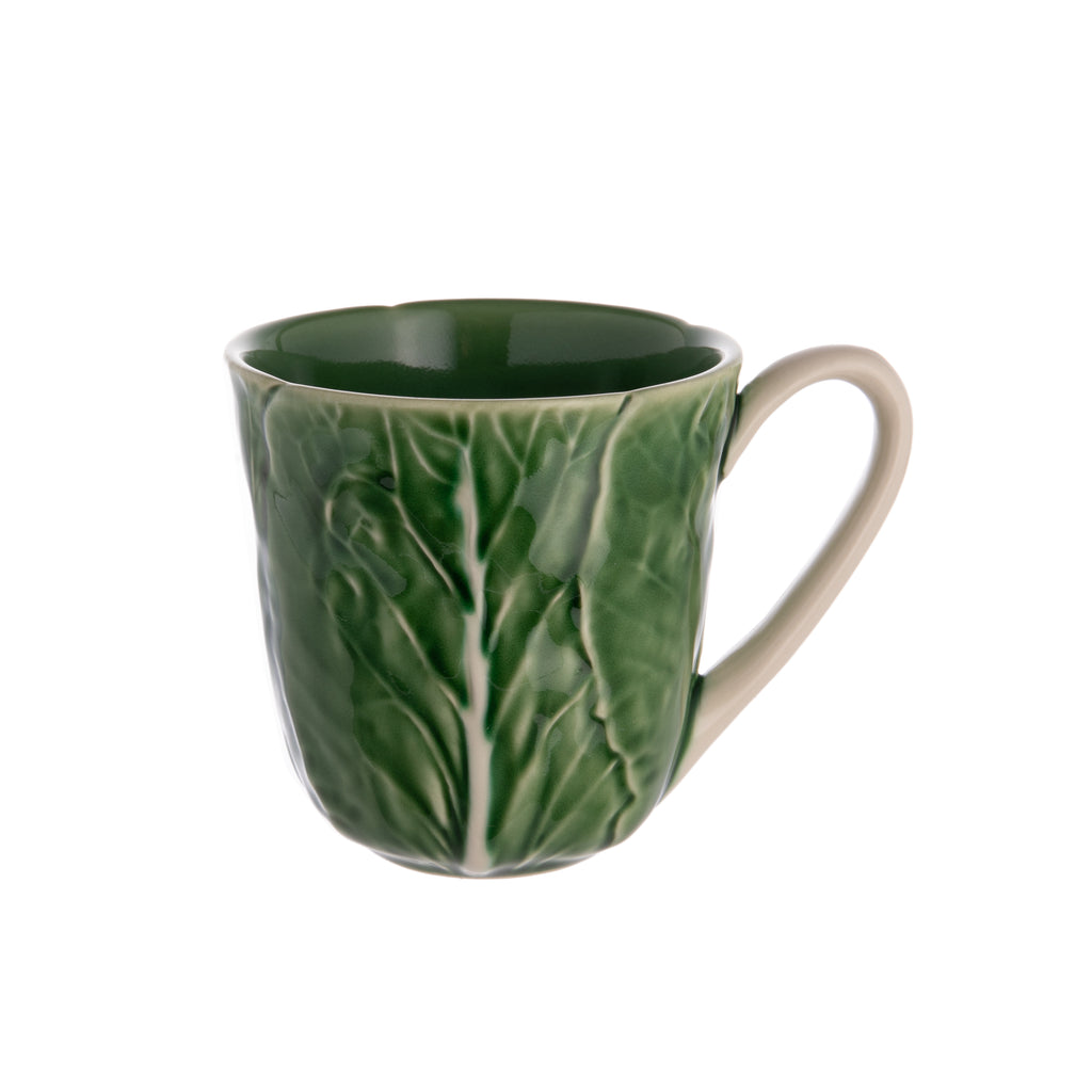 Start your day with a smile with your morning coffee in this delightful cabbage leaf mug. Made by master ceramics atelier Bordallo Pinheiro, which was founded in Caldas da Rainha, Portugal, in 1884. Handmade ceramic mug. Limited edition. Dimensions: 4.25" x 4".