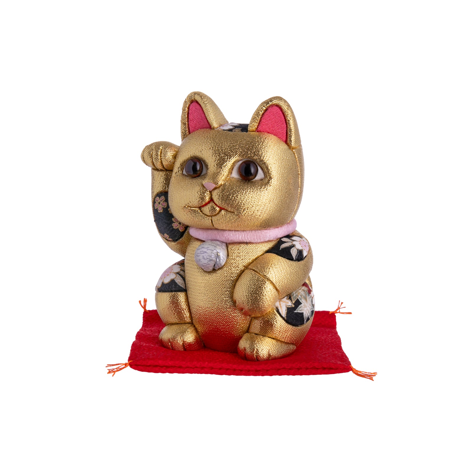 This Lucky Cat is sure to be a lucky addition to your home or even a great gift to send good fortune to friends or family.  With glowing brown eyes, red ears, a pink collar, and gold detail, this Lucky Cat wants to make sure your wishes come true!  Dimensions: approx. 5"x 3"x 3" Materials: crepe silk, polyurethane