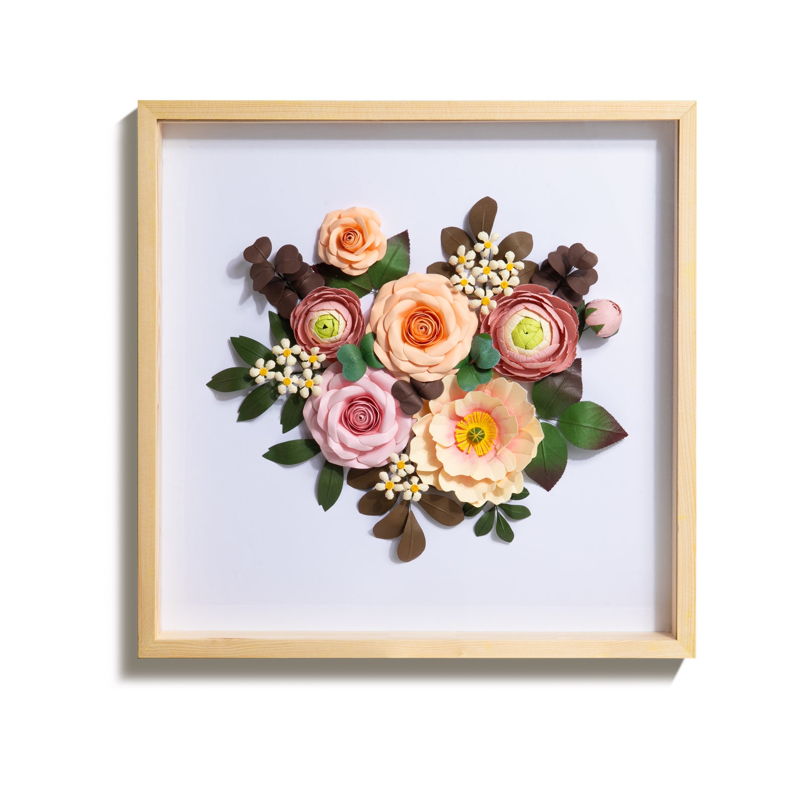 The gift of a beautiful floral bouquet brings joy and beauty into the home. This delightful shadow box art features a handcrafted paper flower bouquet that will brighten up any wall space. Handmade paper flowers mounted in a shadow box frame Materials: paper and glass with a solid pine frame. Dimensions: 15.7" x 15.7".