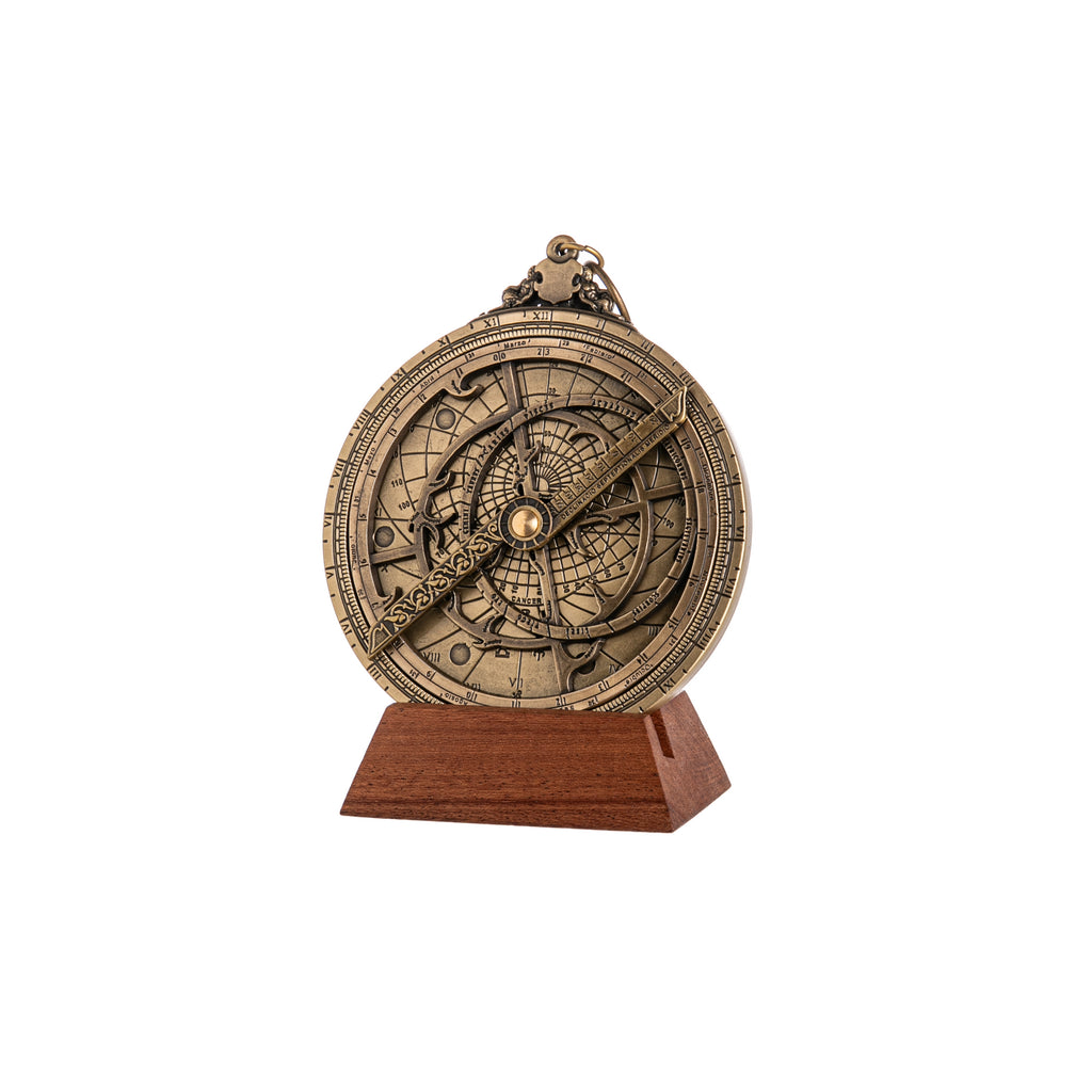 The astrolabe is a sophisticated astronomical instrument used to measure time, azimuths, and declinations of stars. In Europe, the astrolabe was an essential instrument for astronomers, astrologers, and surveyors until the end of the 17th century, when more accurate instruments replaced it. Materials: brass and wood. Dial dimensions: 4" x 4" x 0.3".