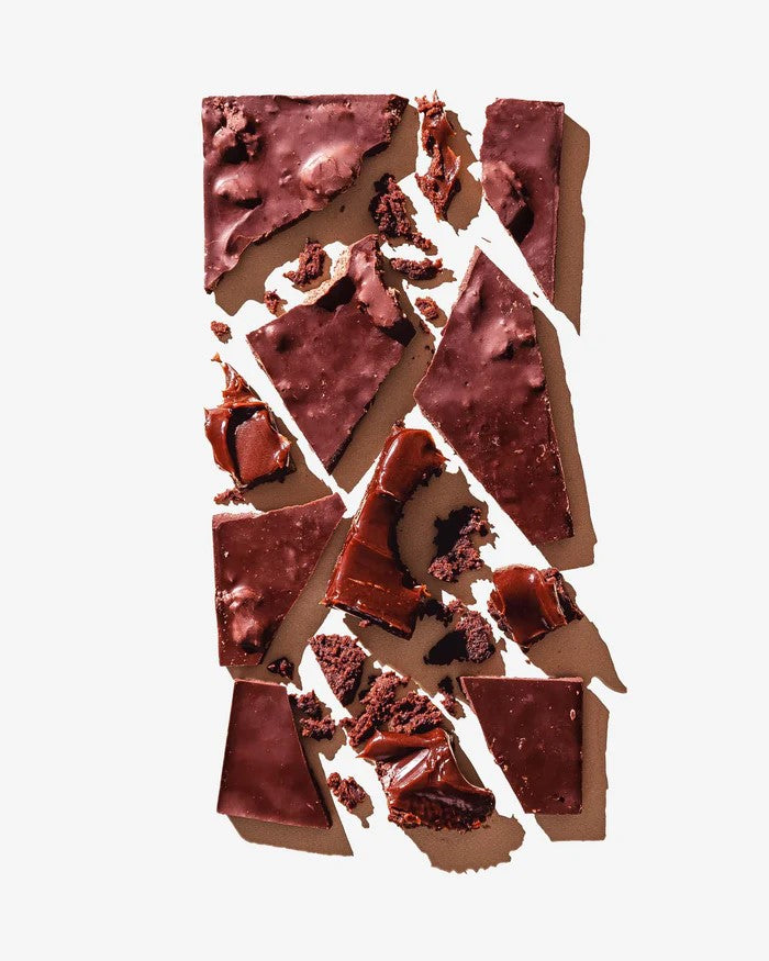 With homemade brownies mixed into dark chocolate for the ultimate brownie and chocolate lover's chocolate bar. Ingredients: Dark Chocolate (Cocoa Mass, Sugar, Cocoa Butter, Soy Lecithin as an Emulsifier, Vanilla), Brownies (Wheat Flour, Cane Sugar, Cocoa Powder, Butter, Eggs, Water, Vanilla, Baking Soda, Sea Salt) 