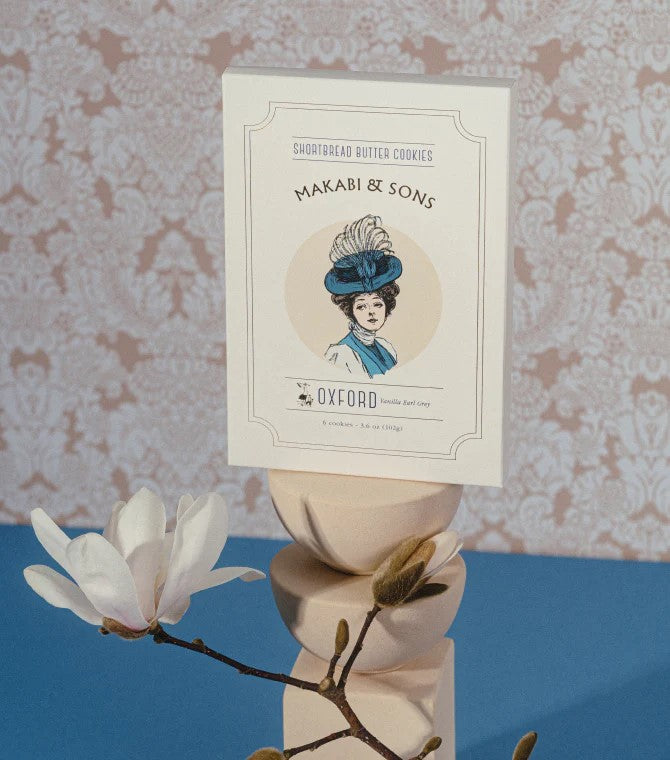 Package of Vanilla Earl Grey Cookies with three cookies displayed in front of the package.