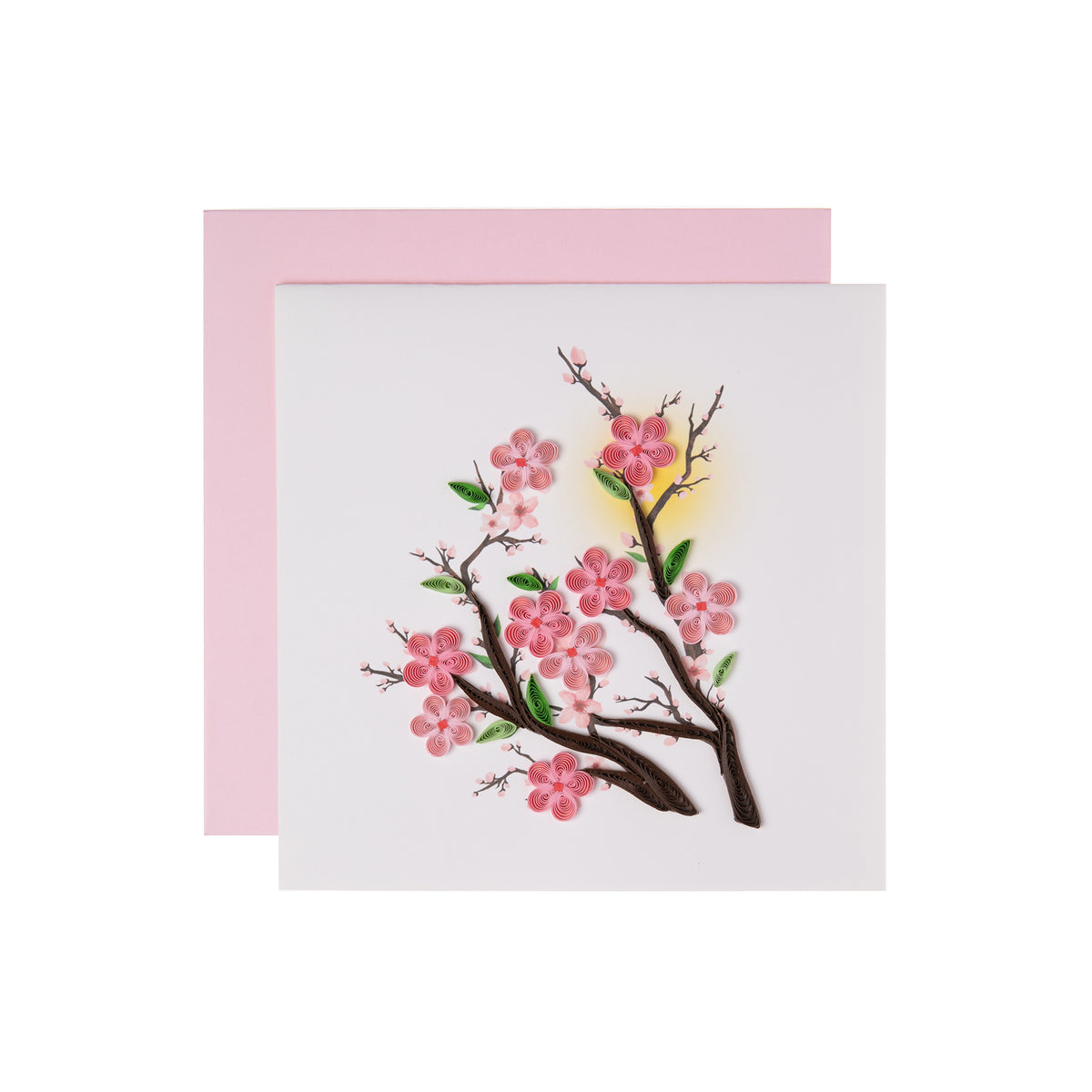 Card with cherry blossom design and pink envelope on white background