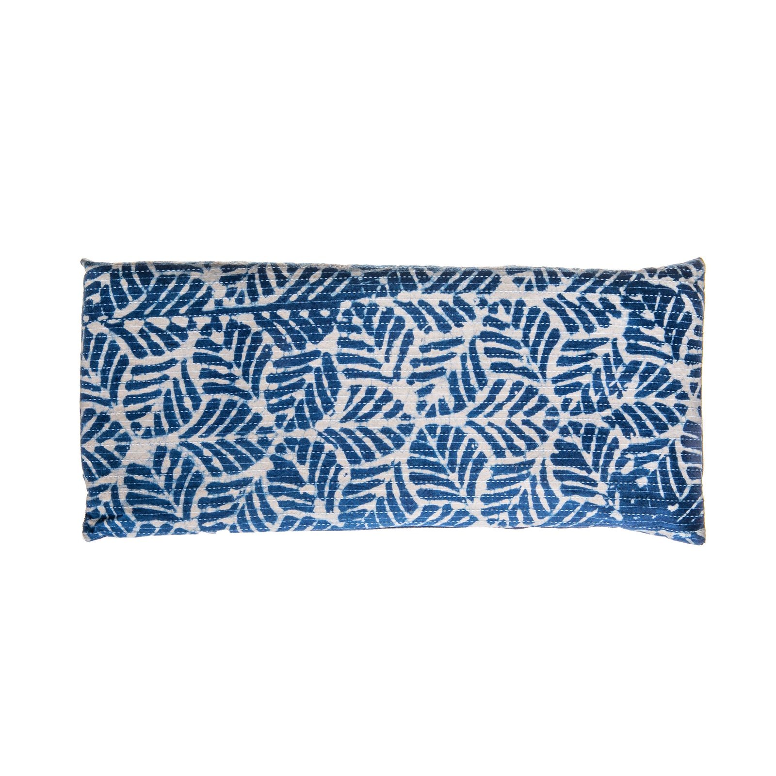 This comforting spa pillow is covered with hand-printed indigo cotton imported from India and backed with a cozy cotton corduroy. Use anywhere on the body to relieve tension and ease muscles aches. Filled with French lavender and hearty flax seeds for a soothing scent and relaxing, weighted feel. Handmade.  7" x 15".