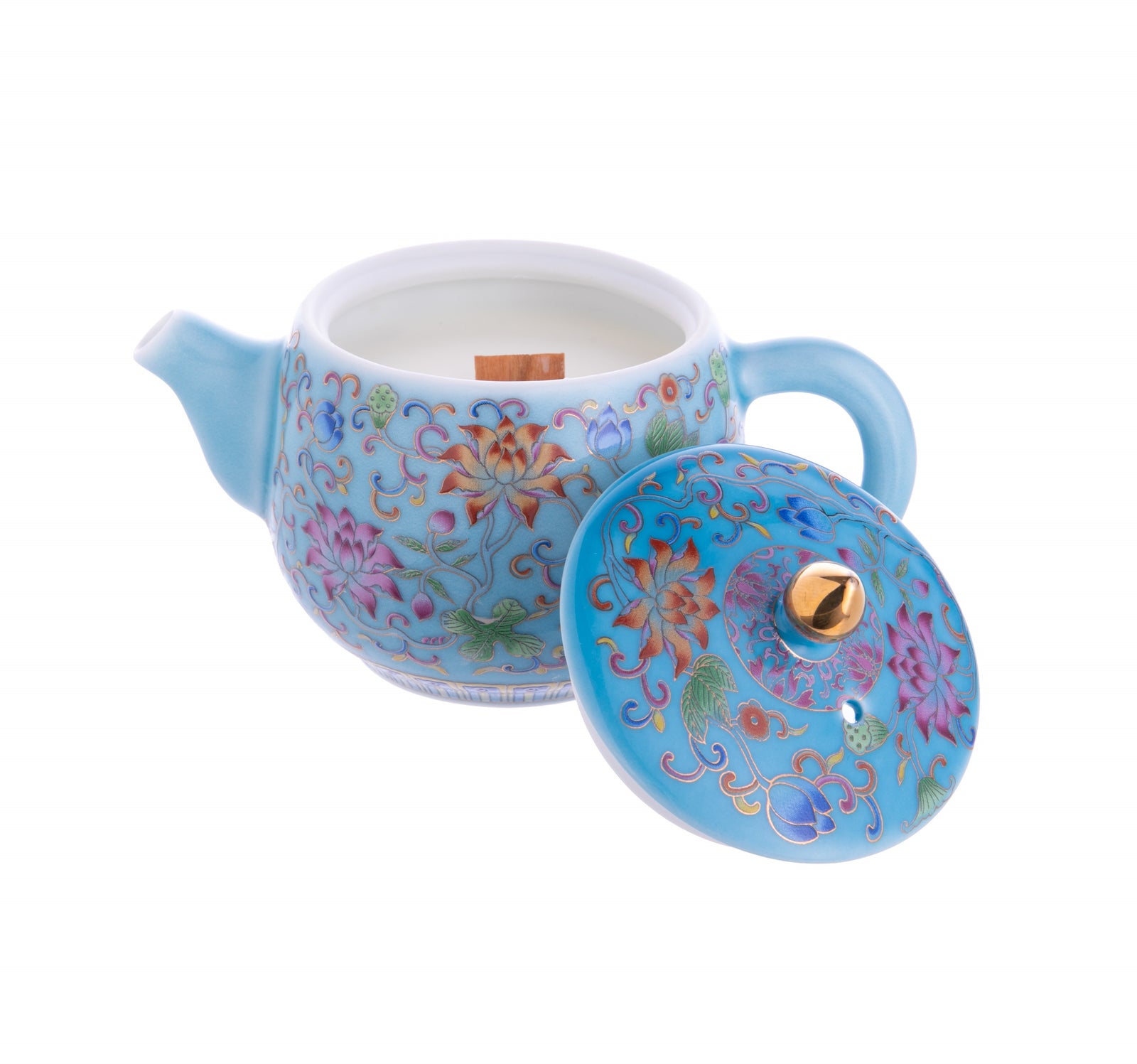 This delightful ceramic teapot is decorated with colorful waterlilies and houses a gorgeously fragranced, wooden wick candle inside, with notes of fresh water and grapefruit. The teapot can be used as a pretty ornament or trinket dish after the candle has been used. Candle: 5" x 3", Keepsake box dimensions: 5" x 5".