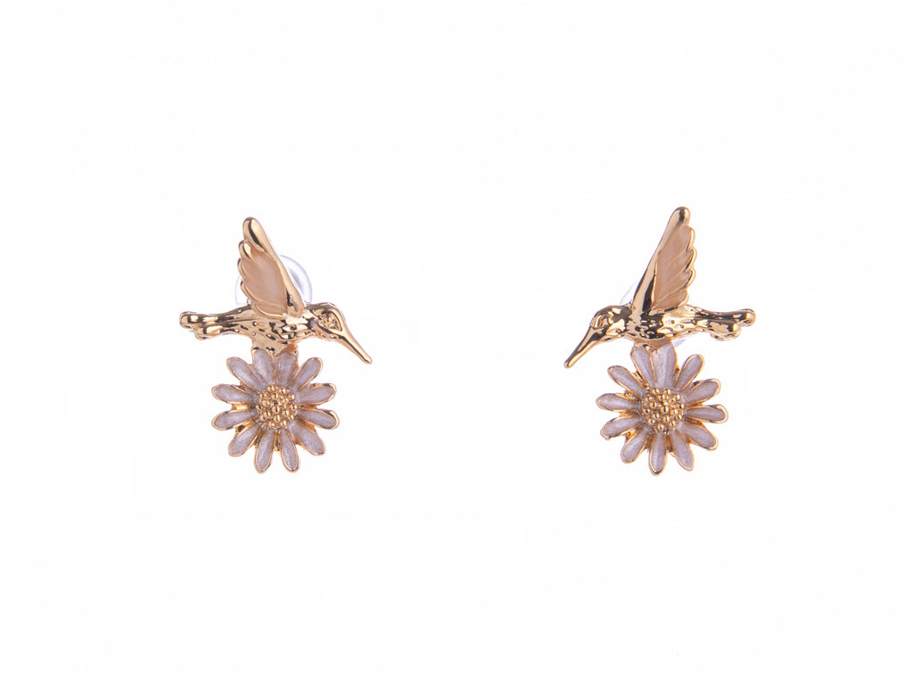 Infuse some whimsy into your jewelry collection with these Hummingbird and Daisy stud earrings. Made from titanium and with an ivory flower detail, these are durable and pretty enough for daily wear. A great gift for bird and nature lovers alike. Material: Titanium, Enamel Dimensions: 0.5" x 0.5" Lead and Nickel-free