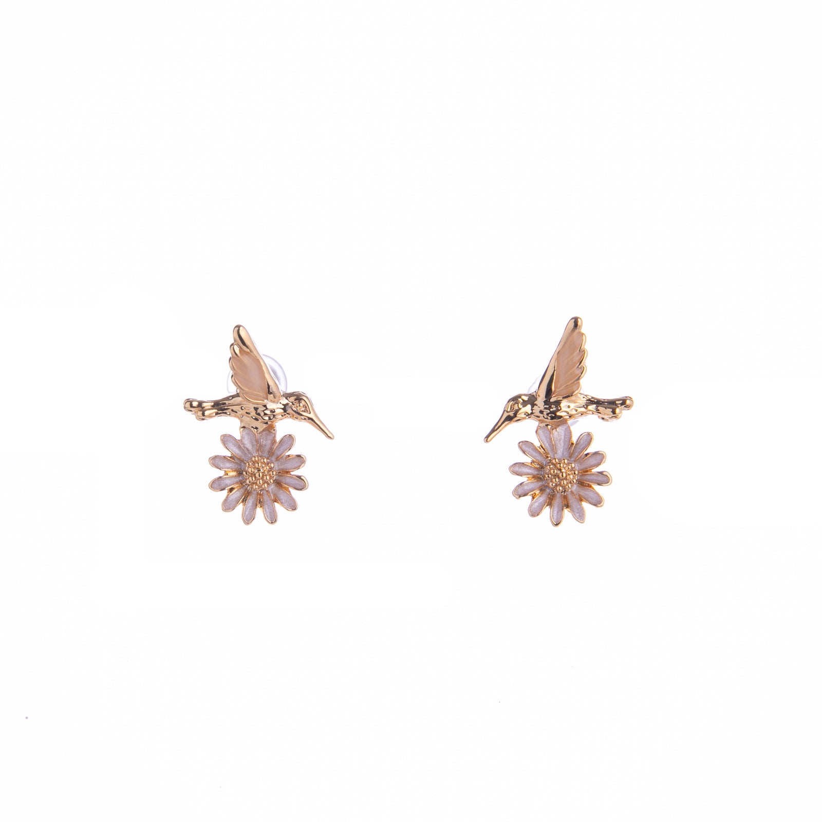 Infuse some whimsy into your jewelry collection with these Hummingbird and Daisy stud earrings. Made from titanium and with an ivory flower detail, these are durable and pretty enough for daily wear. A great gift for bird and nature lovers alike. Material: Titanium, Enamel Dimensions: 0.5" x 0.5" Lead and Nickel-free