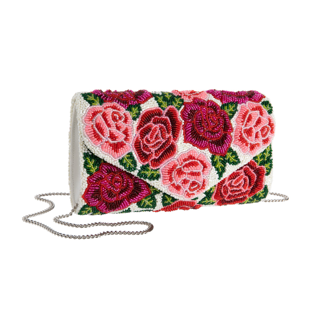 Designed exclusively for the Huntington Store, this fully beaded purse is inspired by our famous Rose Garden. The purse features blooms in deep burgundy, blush pink, and classic red, and the layered, multitone beading give them a wonderful 3D effect. Exclusive to the Huntington Store. Dimensions: 8.5" x 5.5" x 2".