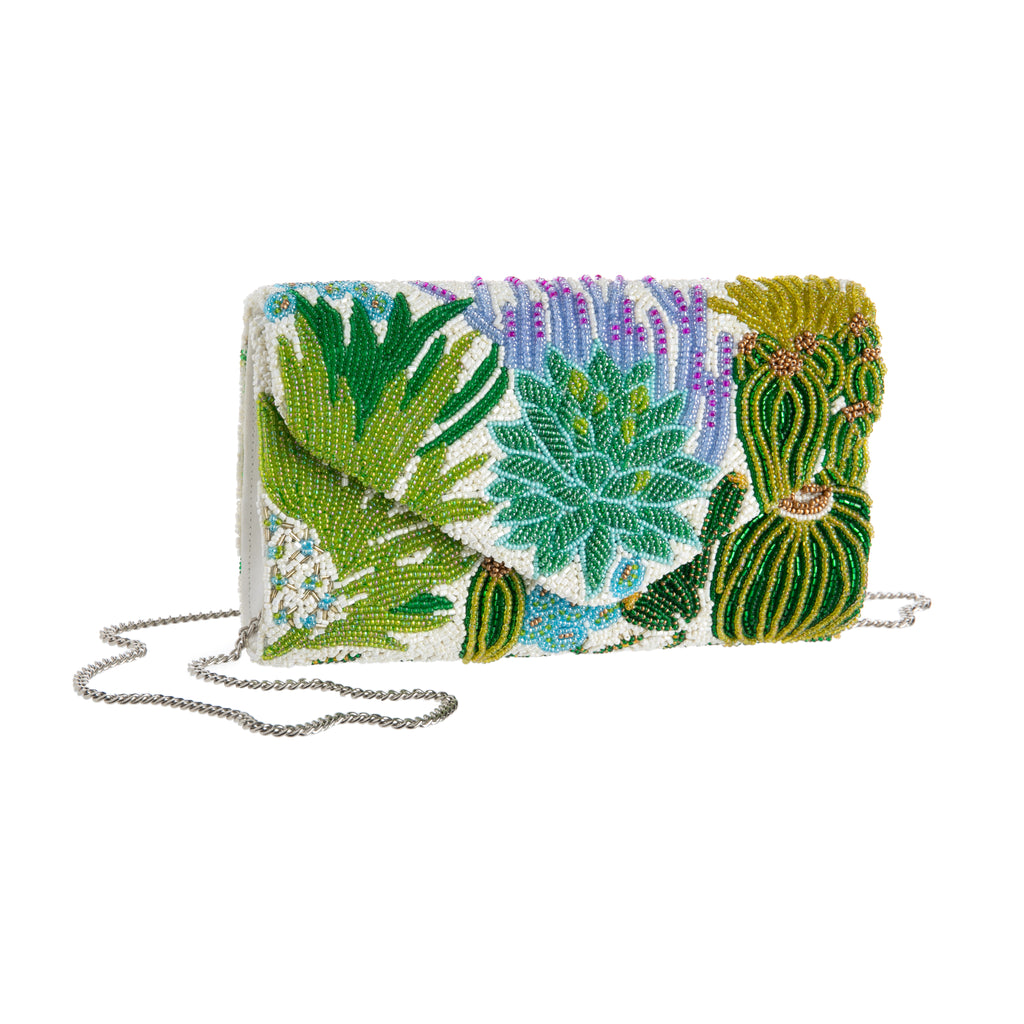 Designed exclusively for the Huntington Store, this stunning, fully beaded purse is inspired by our famous Desert Garden. Its layered, multitone beaded artwork features many of the most recognizable plants in that collection. Hand-beading, satin, and metal chain strap Dimensions: 8.5" x 5.5" x 2".