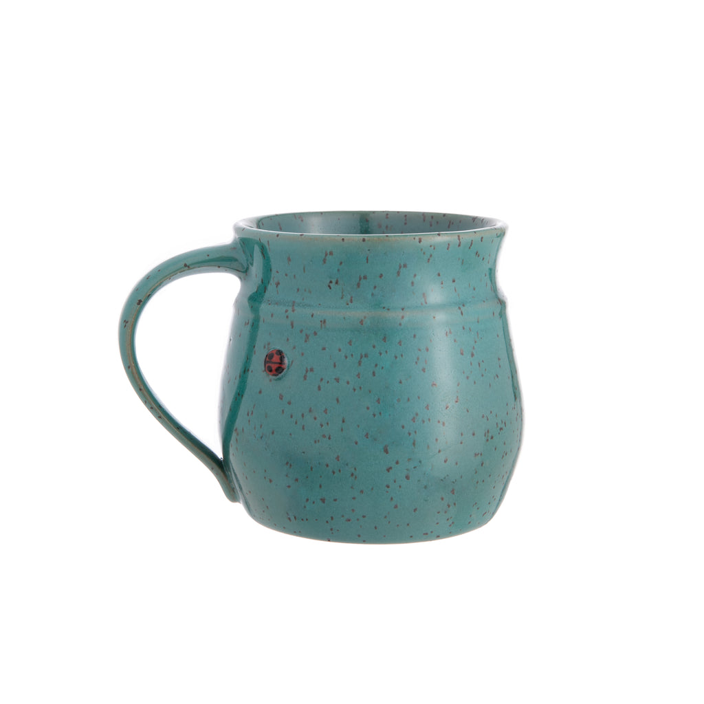 This delightful stoneware mug is made entirely by hand. Each mug is thrown on a potter’s wheel, and a cute clay ladybug is added before the mug is fired and hand glazed. Material: stoneware clay 100% handmade Dimensions: 4" x 3.25" Holds approximately 12 oz. Microwave and dishwasher safe.