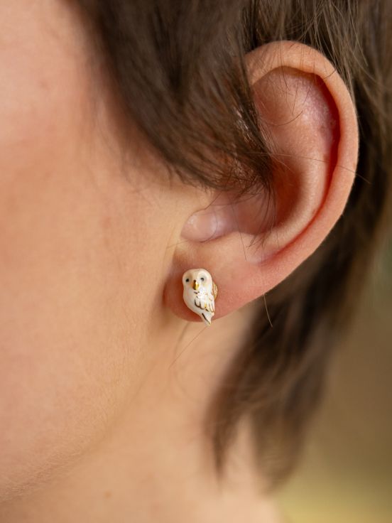 These charming tiny owl studs will perch perfectly on your ear. Hand-painted with gold detail, these little owls add a delicate touch of nature to your look. This makes the perfect gift for any owl lover or bird watcher. Lead and Nickel-free Material: Porcelain, Gold-plated Stainless Steel Designed in Toulouse, France 