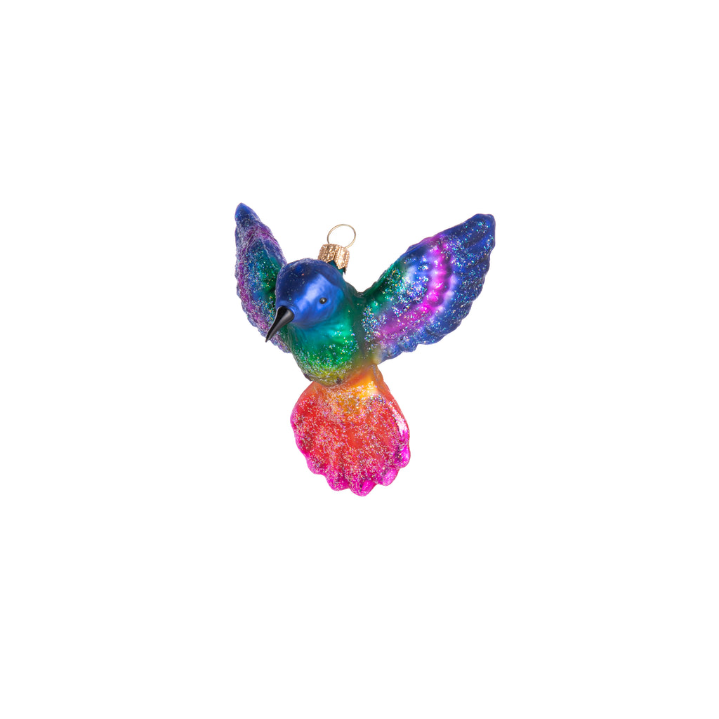 This glittery and colorful hummingbird is sure to bring delight to your home when hung in the window or on a holiday tree. Finished with a glitter effect, this sweet hummingbird ornament will dazzle as if mid-flight!  Comes in 5 different colors as each style will brighten up the room!  Dimensions: 3.5" x 3.5" x 3"