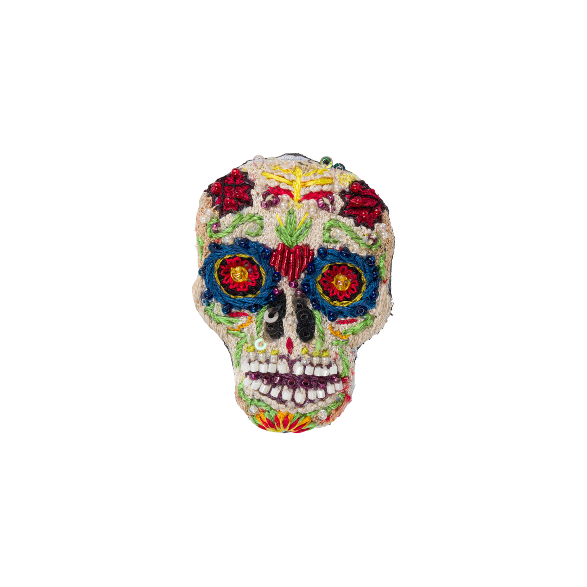 A colorful embroidered sugar skull brooch with intricate floral and geometric patterns in red, blue, yellow, green, and white on a plain white background.