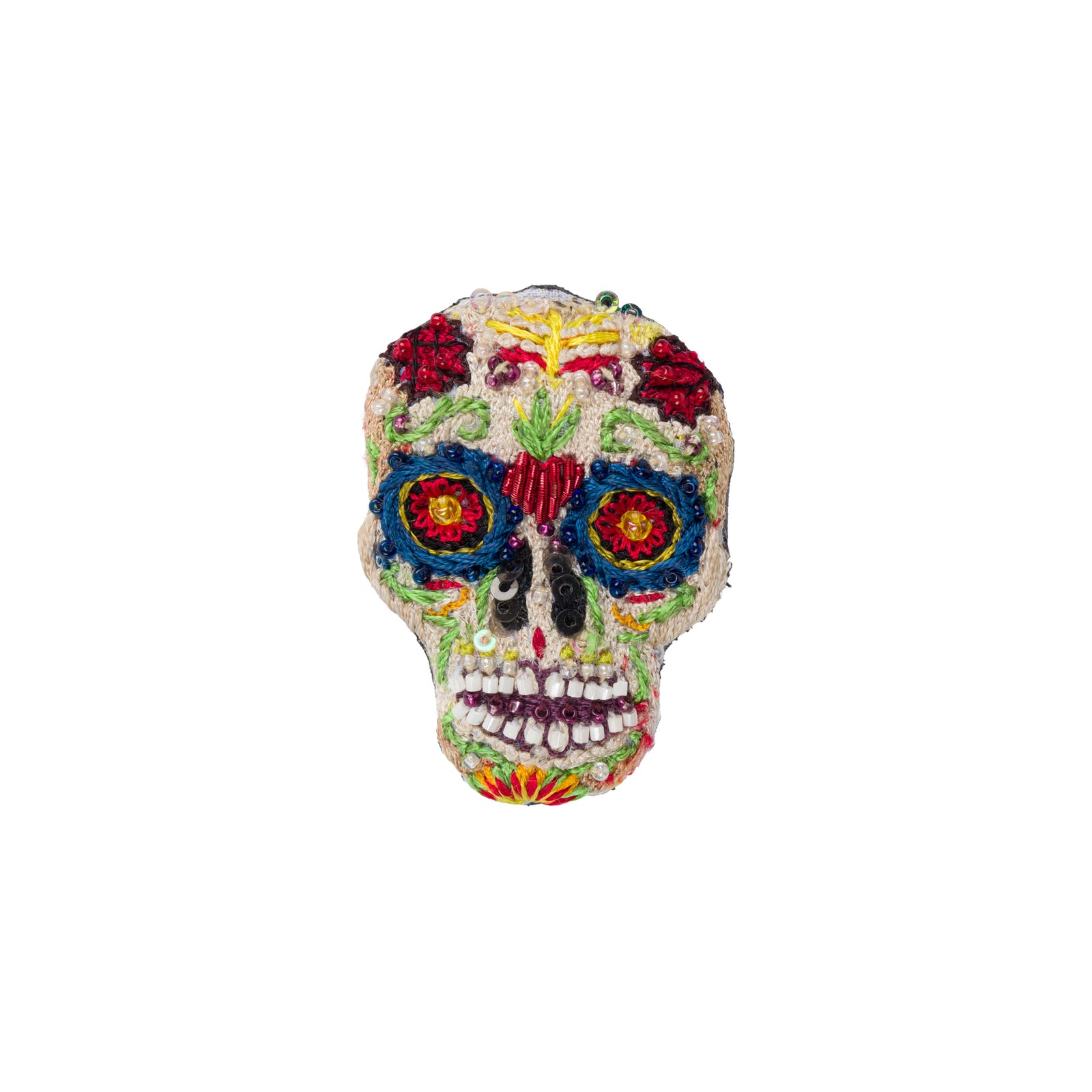 A colorful embroidered sugar skull brooch with intricate floral and geometric patterns in red, blue, yellow, green, and white on a plain white background.