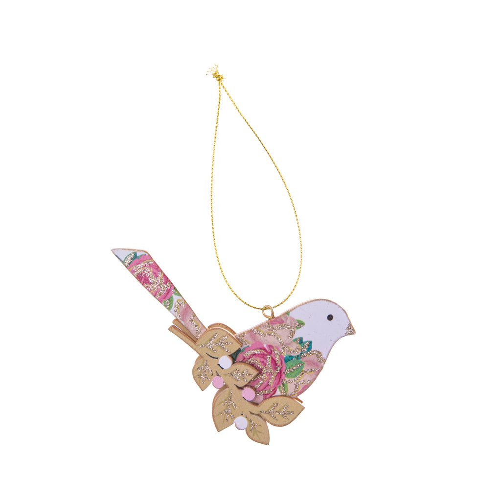 This adorable bird decorated with pink rose print perched on a branch is the perfect ornament for your home or holiday decor. Adorned with glitter, this whimsical bird is adorable hung up mid-flight. Comes with gold ribbon for hanging. Dimensions: 4" W x 2.5" L Material: Glitter-decorated wood