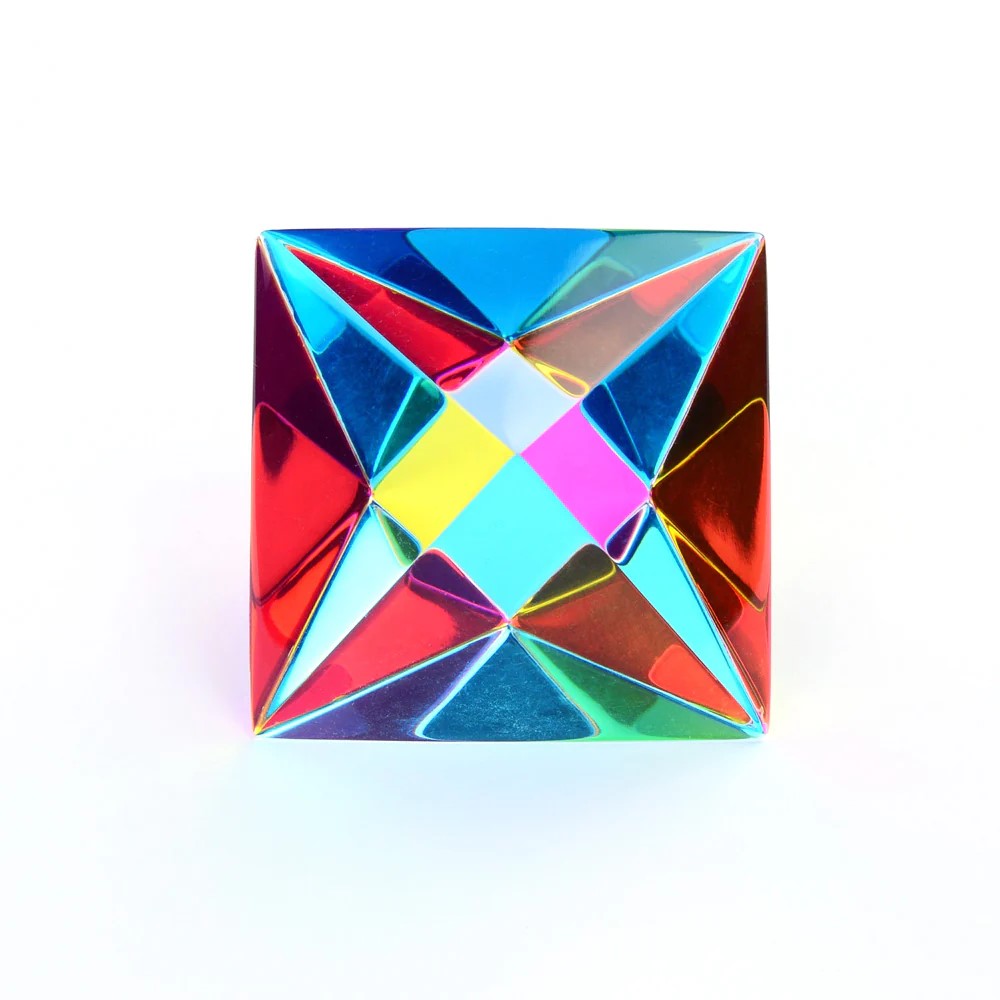 A colorful Aether cube made up of two four-sided pyramids that meet at the base, displaying a blend of cyan, magenta, and yellow colors.