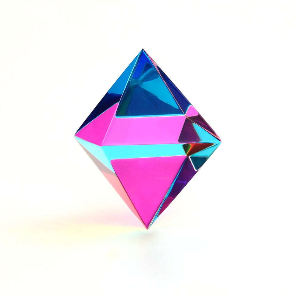 A colorful Aether cube made up of two four-sided pyramids that meet at the base, displaying a blend of cyan, magenta, and yellow colors.