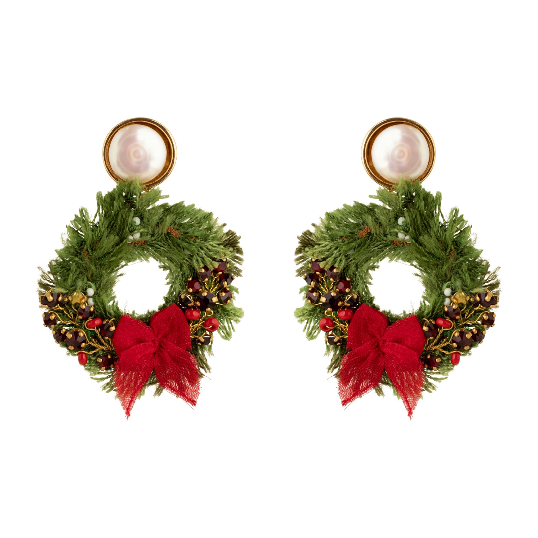 Pair of earrings shaped like Christmas wreaths with red bows on a white background