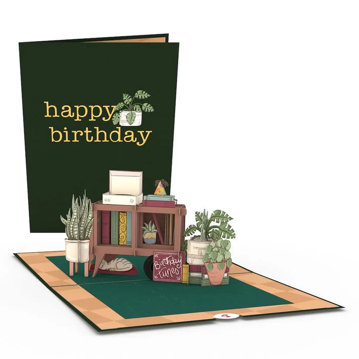 Send your favorite plant lover this 3D pop-up card for their birthday! With its imagery of the perfect plant (and book) lover's paradise, this card is great to send a birthday message to a friend or family member. 3D pop-up card Includes an envelope and a note card Dimensions when closed: 5" x 7"