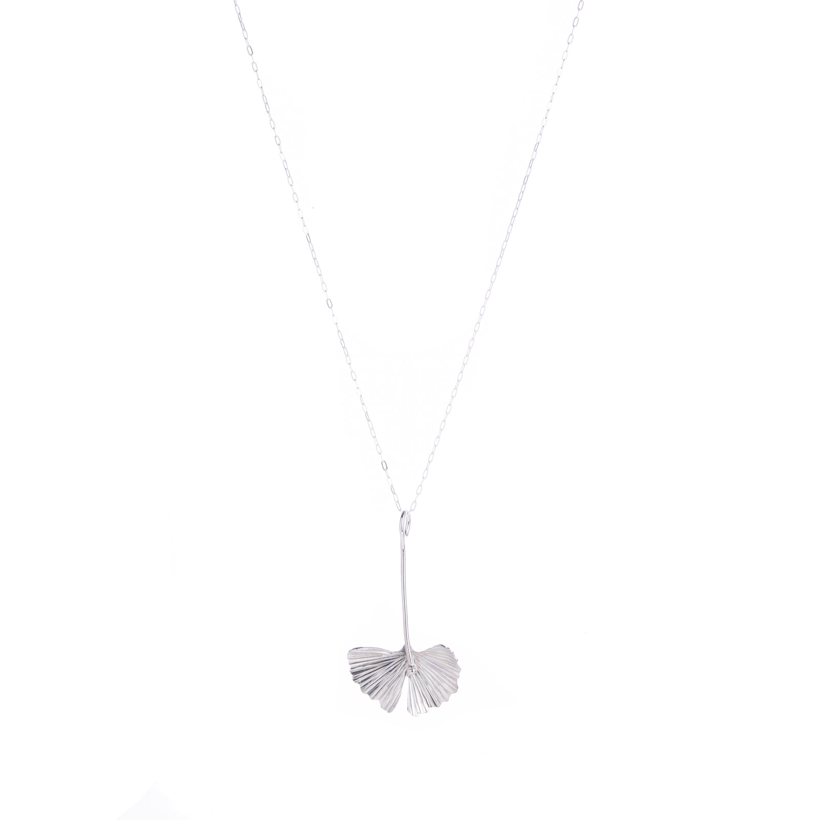 This sterling silver drop necklace features the ginkgo leaf. With a sterling silver chain, this handcrafted drop necklace will add botanical charm to any outfit. Would make a gorgeous gift for anyone looking to add ginkgo glam to their look. Handcrafted Material: Sterling Silver (.925) Dimensions: 1.5" x 1" x 0.5"