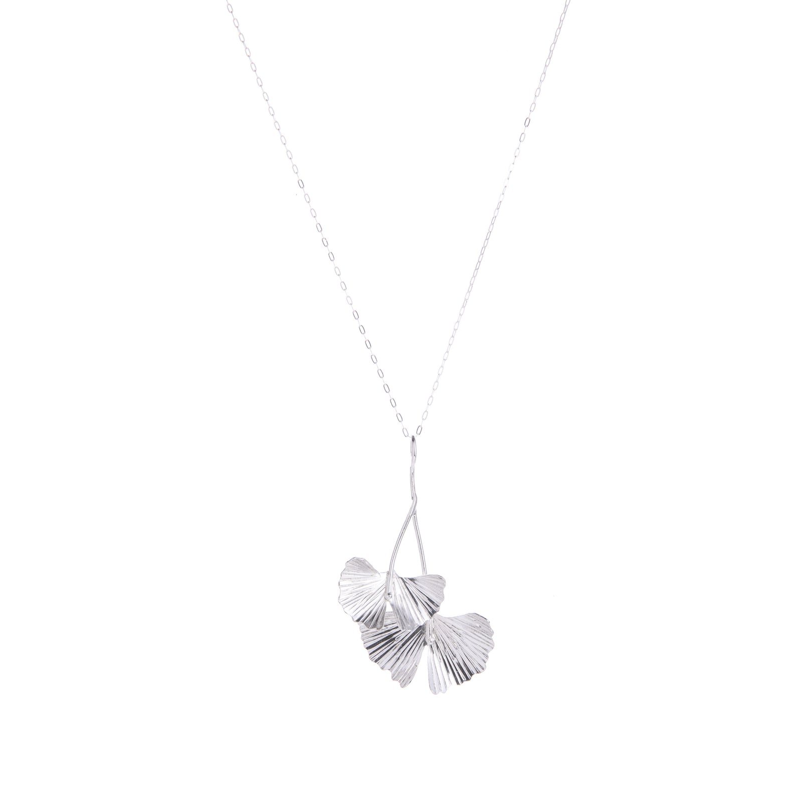 Celebrate the ginkgo tree with this sterling silver pendant necklace featuring ginkgo leaves. With a sterling silver chain, this handcrafted necklace will add botanical charm to any outfit. Would make a gorgeous gift. Handcrafted Material: Sterling Silver (.925) Dimensions: 4.0" x 2.5" x 0.5"