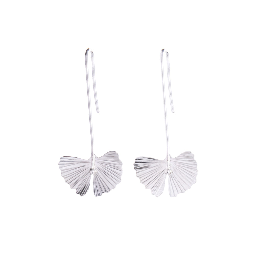 These sterling silver drop earrings feature the ginkgo leaf. With a sterling silver chain, these handcrafted earrings will add botanical charm. Would make a gorgeous gift for anyone looking to add ginkgo glam to their look. Handcrafted Material: Sterling Silver (.925) Dimensions: 2.25" x 1" x 0.5" (including the drop)