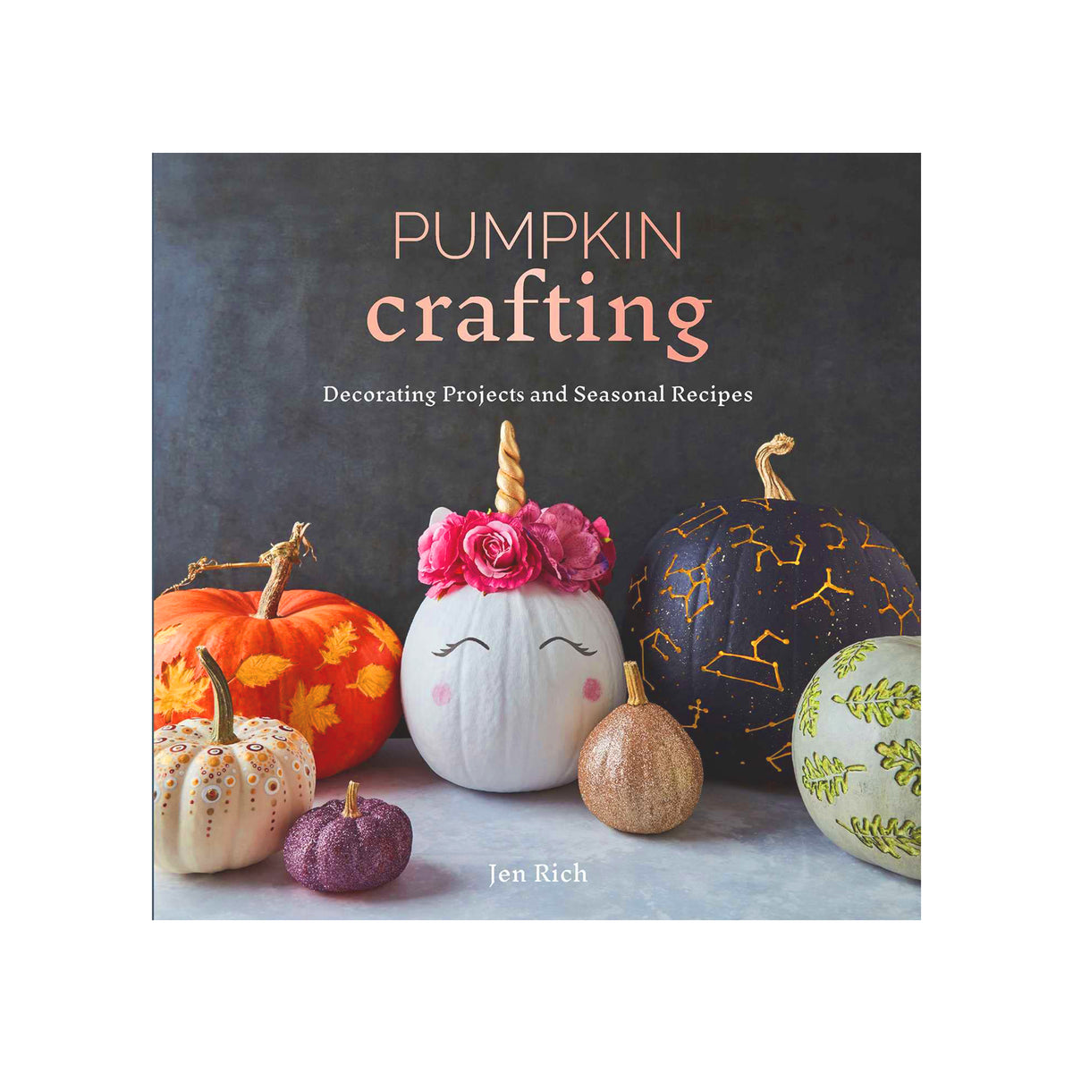 Book cover for 'Pumpkin Crafting: Decorating Projects and Seasonal Recipes' by Jen Rich, featuring a styled arrangement of decorative pumpkins on a dark gray background.