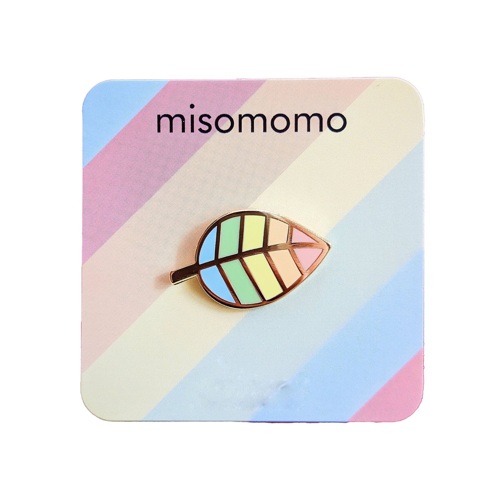 Show off your pride with this pastel rainbow leaf pin! Add it to your jacket, bag, beanie, or pin collection for a subtle yet proud statement.  With yellow gold detail and pastel colors, it's sure to look unbe-leaf-ably cute wherever you pin it.  Dimensions: 1.25" length Materials: Enamel, yellow gold metal 