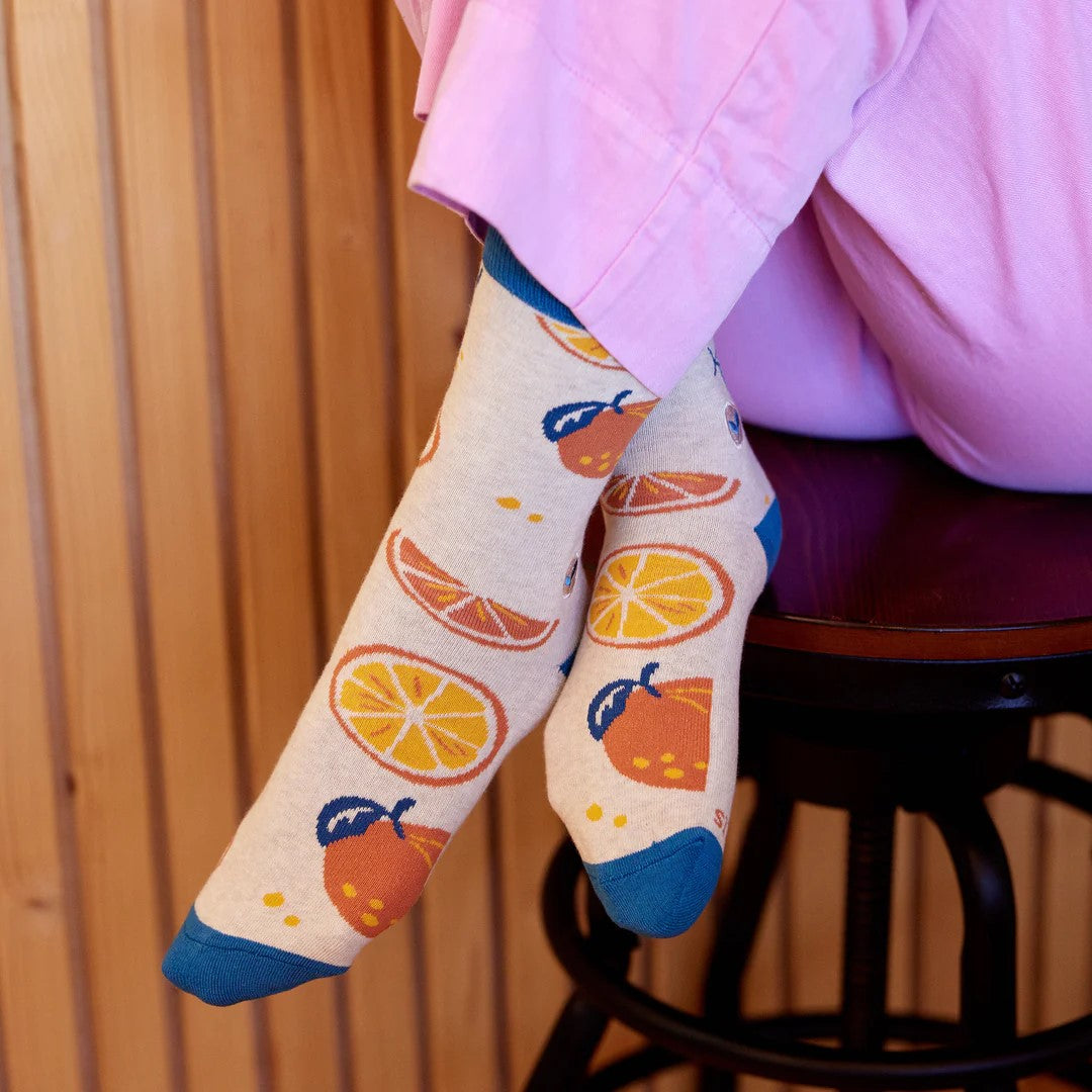 Brighten your outfit with a dose of Vitamin C! These fresh-squeezed socks (that also plant trees) are cute, comfy, and stylish... orange you glad you saw them? A cheerfully sweet gift for all your citrus lovers.  Fairtrade, Certified Organic Cotton Vegan Terry padding for comfort 