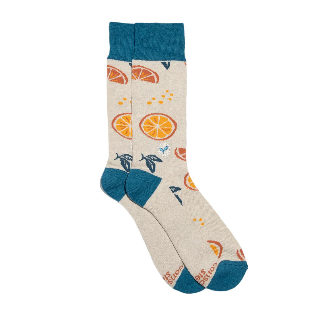 Brighten your outfit with a dose of Vitamin C! These fresh-squeezed socks (that also plant trees) are cute, comfy, and stylish... orange you glad you saw them? A cheerfully sweet gift for all your citrus lovers.  Fairtrade, Certified Organic Cotton Vegan Terry padding for comfort 