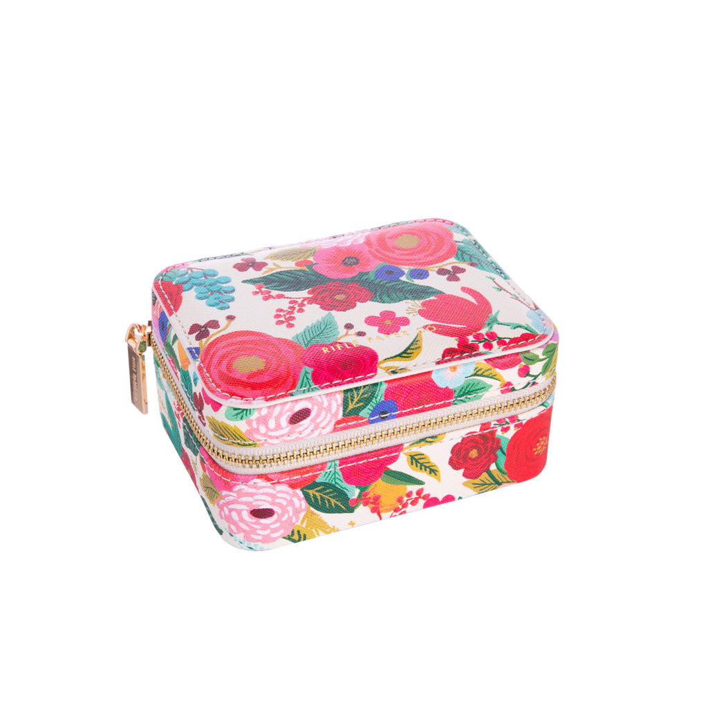 Keep your jewels safe and protected with this Garden Party travel jewelry case! In bright floral print, this jewelry case is stylish and efficient. With compartments inside for rings, necklaces, and earrings, it is a great compact size. Dimensions: Approx. 2.25" H x 4.5" W x 3.5" L Material: Polyurethane, Polyester