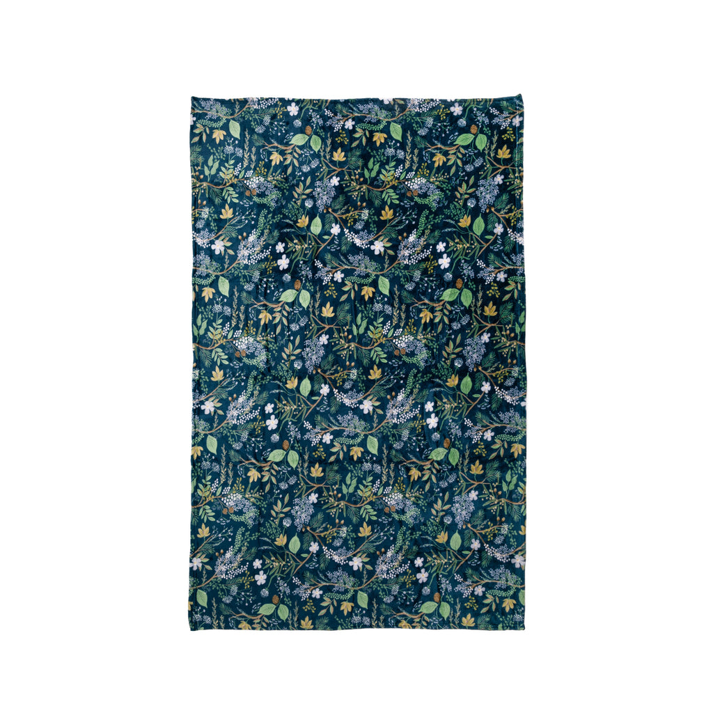 Cozy up with this forest-print, soft fleece blanket. Use as a throw to add a pop of print to your couch, as an extra blanket on your bed, or even as a pretty picnic blanket. Materials: 100% polyester soft fleece Dimensions: 80" x 50"