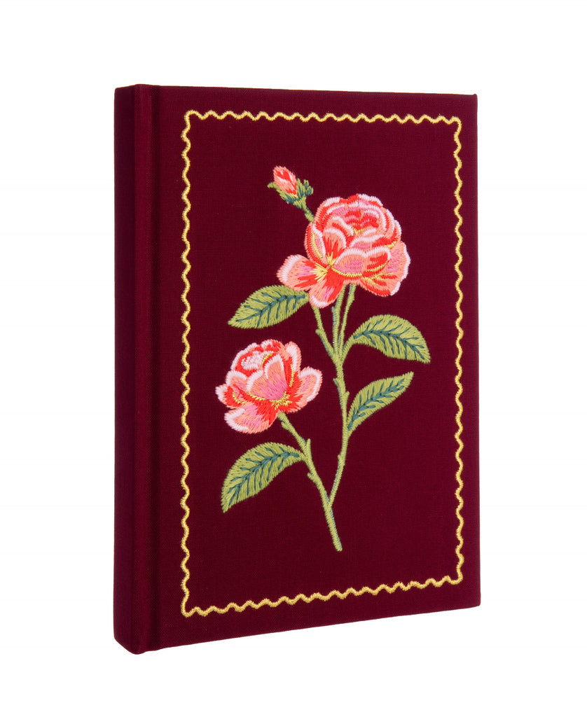 "A rose is a rose is a rose..." Embroidered roses with gold thread accents make this lined journal beautiful enough to keep at your desk or to carry with you for the day. With 240 pages, there is plenty of space for your daily journaling, creative notes, or random thoughts. With ribbon bookmark. 5.75" W × 8".