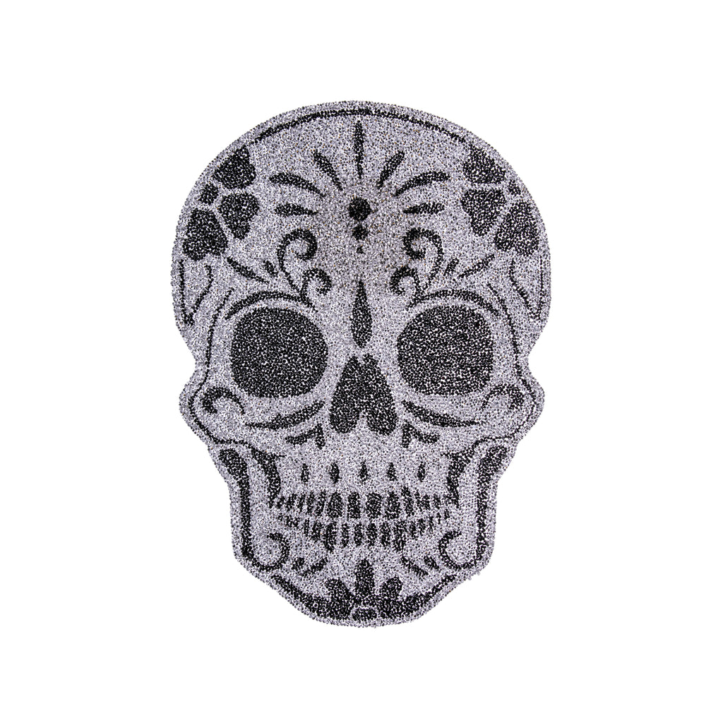 This sugar skull placemat will liven up your Halloween or Dia de Los Muertos decor and bring some glitz and glamour to spooky season. With sparkly black and silver rhinestones this sugar skull is sure to bring in the shine at your next dinner party. Material: Rubber Backing, Resin Rhinestones Dimensions: 13" x 17"