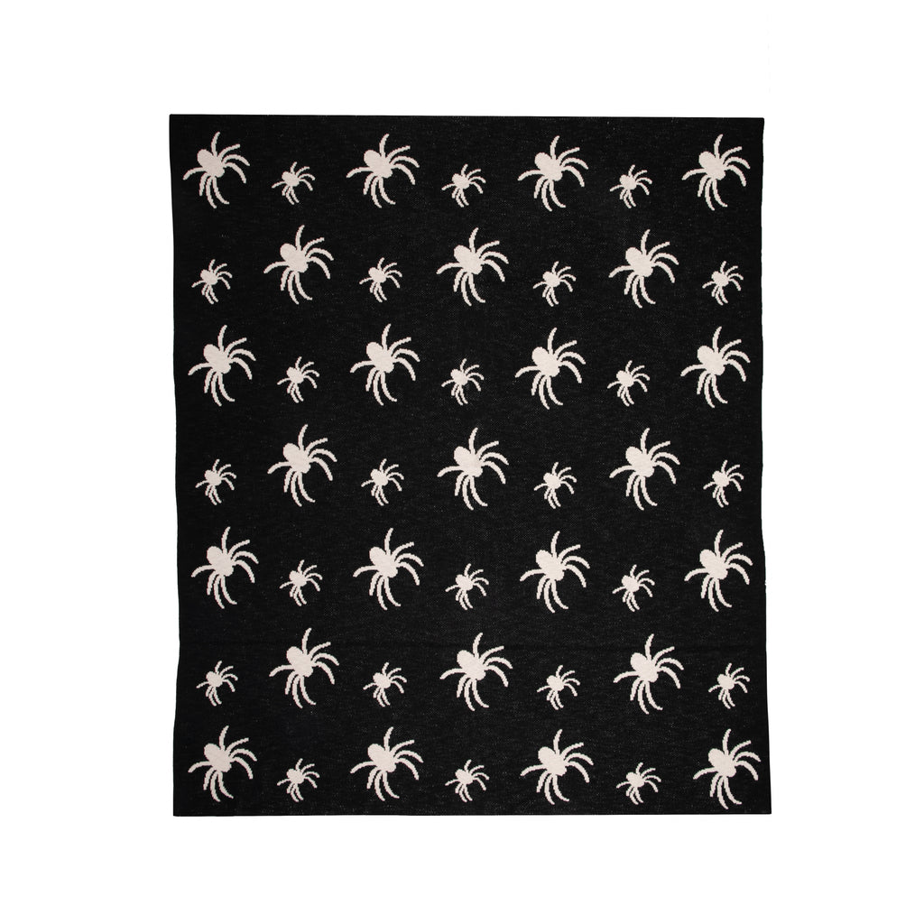 Cozy up your Halloween decor in your home with this knit, 100% cotton black and white throw blanket. This blanket is warm, soft, and gives a very scary yet super chic vibe for Halloween. Would make a great housewarming gift, as long as your loved ones don't have arachnophobia.  Knit throw blanket Material: 100% Cotton