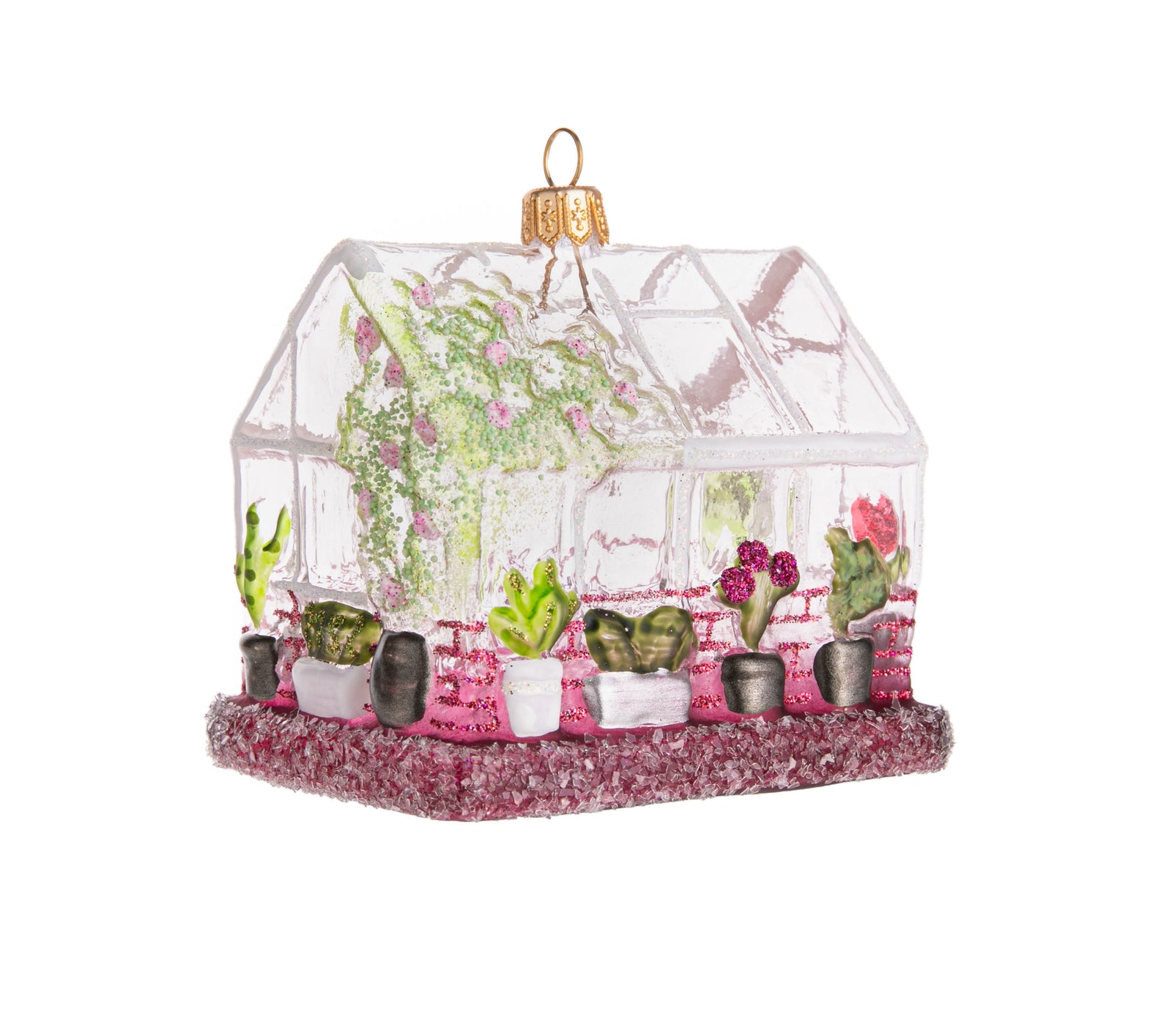 Is your greenhouse your happy place? If so, then this is the ornament for you. This handmade glass ornament features trees and potted plants outside a multi-windowed greenhouse, all topped off with plenty of light-catching sparkle! Handmade and hand glittered glass ornament. Dimensions: 3" x 3.25" x 2.25"