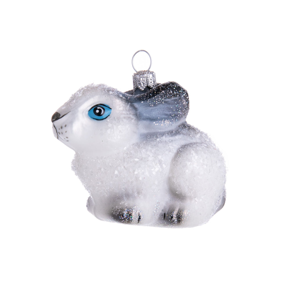 Hop on over to see how cute this glistening bunny ornament is! Hand-decorated with glitter, this adorable bunny has bright blue eyes and streaks of black. 