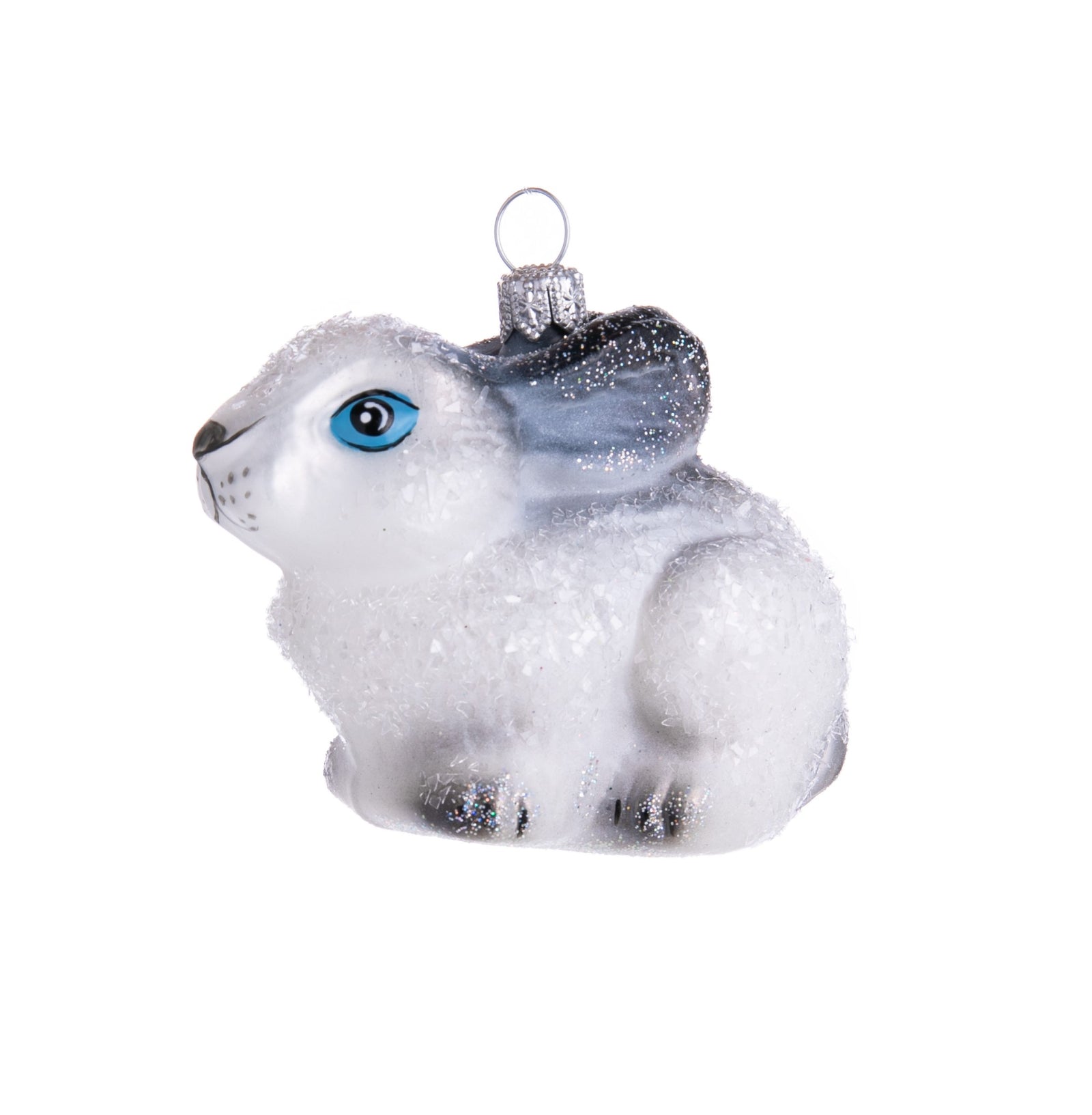 Hop on over to see how cute this glistening bunny ornament is! Hand-decorated with glitter, this adorable bunny has bright blue eyes and streaks of black. 